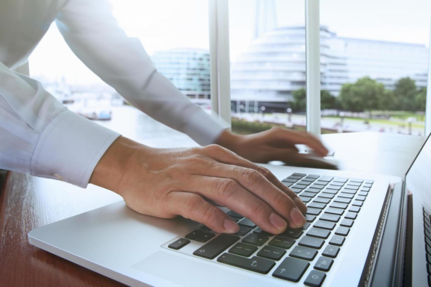 Students working on blockchain development projects in a modern learning environment
